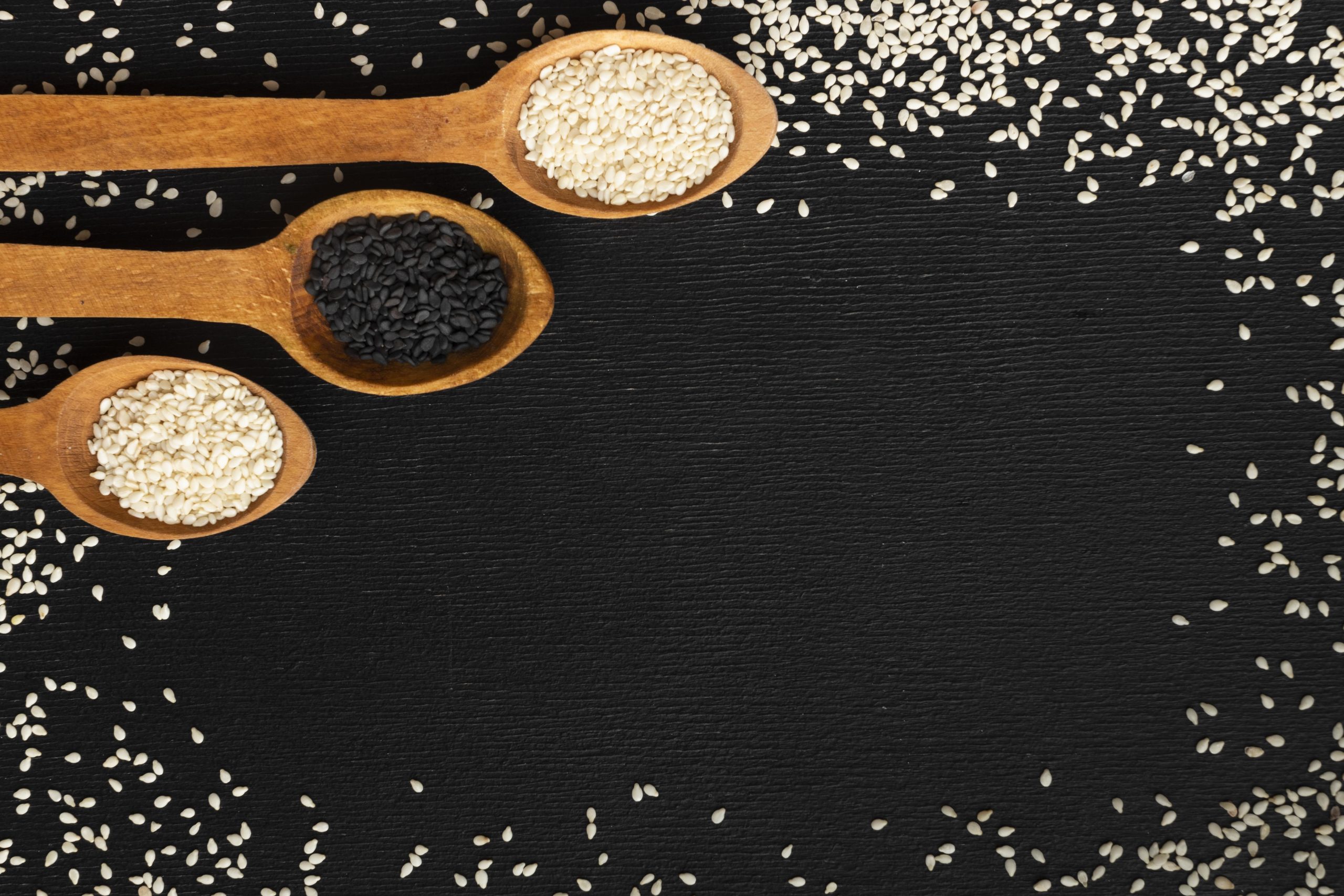 top view seeds frame with wooden spoons